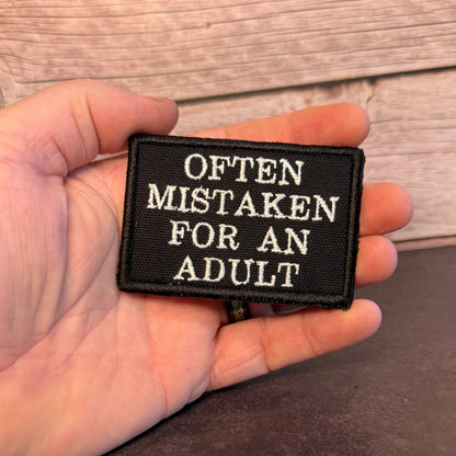Often Mistaken For An Adult Funny Morale Patch, 2x3" | Made in USA | VELCRO® Brand Hook Backing