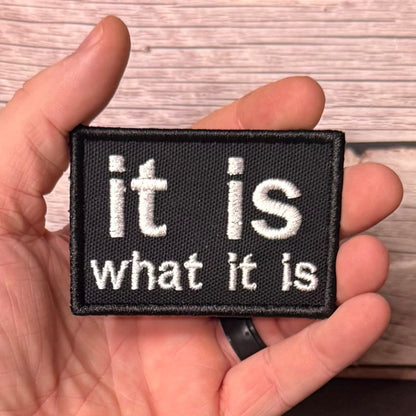 It Is What It Is Funny Morale Patch, 2x3" | Made in USA | VELCRO® Brand Hook Backing