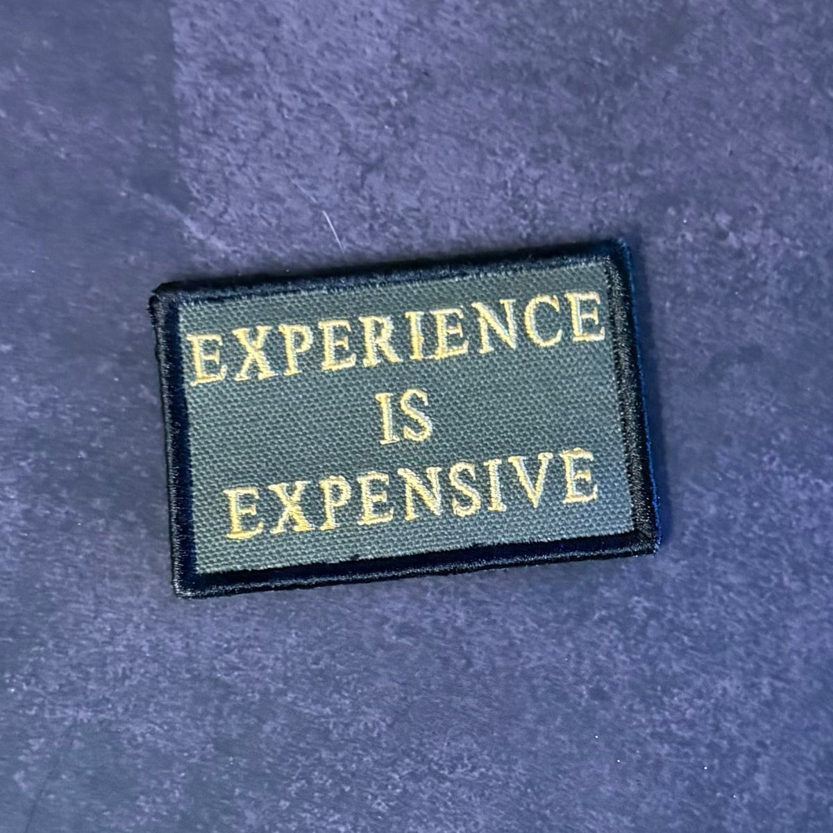 Experience Is Expensive Funny Tactical Morale Patch, 2x3" | Made in USA | VELCRO® Brand Hook Backing