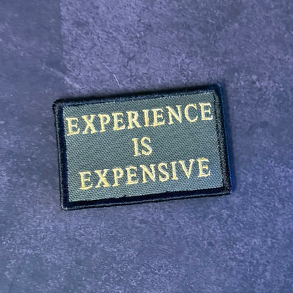 Experience Is Expensive Funny Tactical Morale Patch, 2x3" | Made in USA | VELCRO® Brand Hook Backing