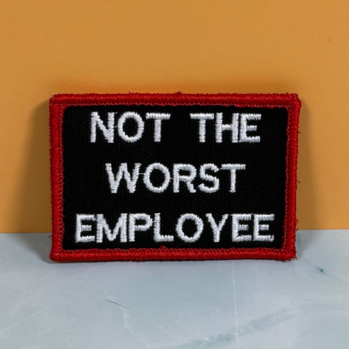Not The Worst Employee Funny Morale Patch, 2x3" | Made in USA | VELCRO® Brand Hook Backing