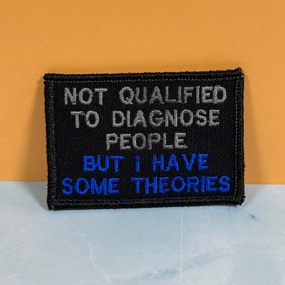 Not Qualified to Diagnose People, But I Have Theories Funny Morale Patch, 2x3" | Made in USA | VELCRO® Brand Hook Backing