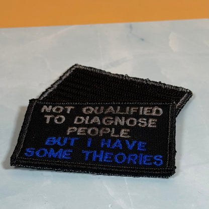 Not Qualified to Diagnose People, But I Have Theories Funny Morale Patch, 2x3" | Made in USA | VELCRO® Brand Hook Backing