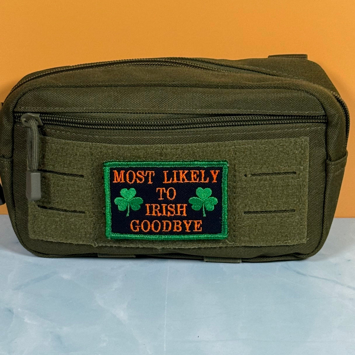 Most Likely To Irish Goodbye Funny Morale Patch, 2x3" | Made in USA | VELCRO® Brand Hook Backing