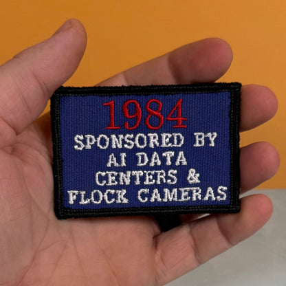 1984 - Sponsored by AI Data Centers & Flock Cameras Funny Morale Patch, 2x3" | Made in USA | VELCRO® Brand Hook Backing