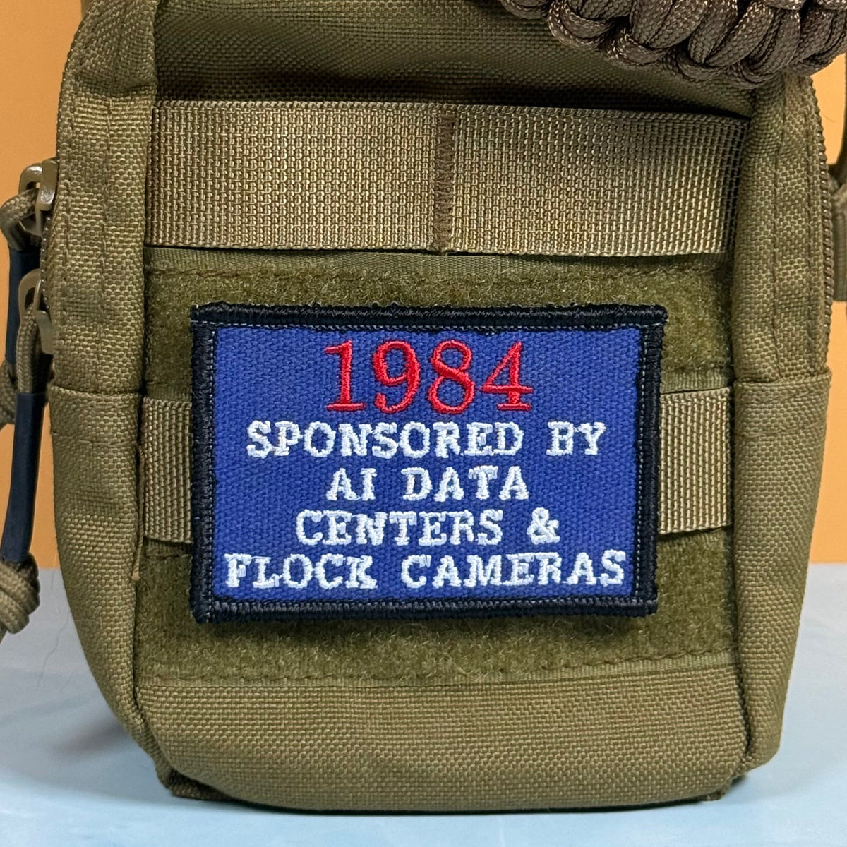 1984 - Sponsored by AI Data Centers & Flock Cameras Funny Morale Patch, 2x3" | Made in USA | VELCRO® Brand Hook Backing