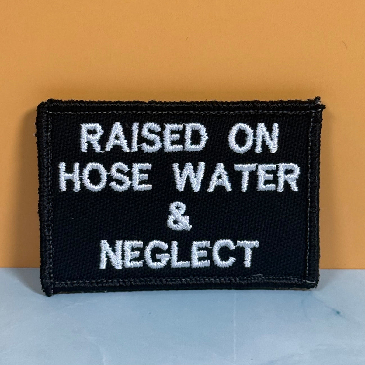 Raised on Hose Water & Neglect Funny Morale Patch, 2x3" | Made in USA | VELCRO® Brand Hook Backing