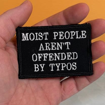 Moist People Aren’t Offended by Typos Funny Morale Patch, 2x3" | Made in USA | VELCRO® Brand Hook Backing
