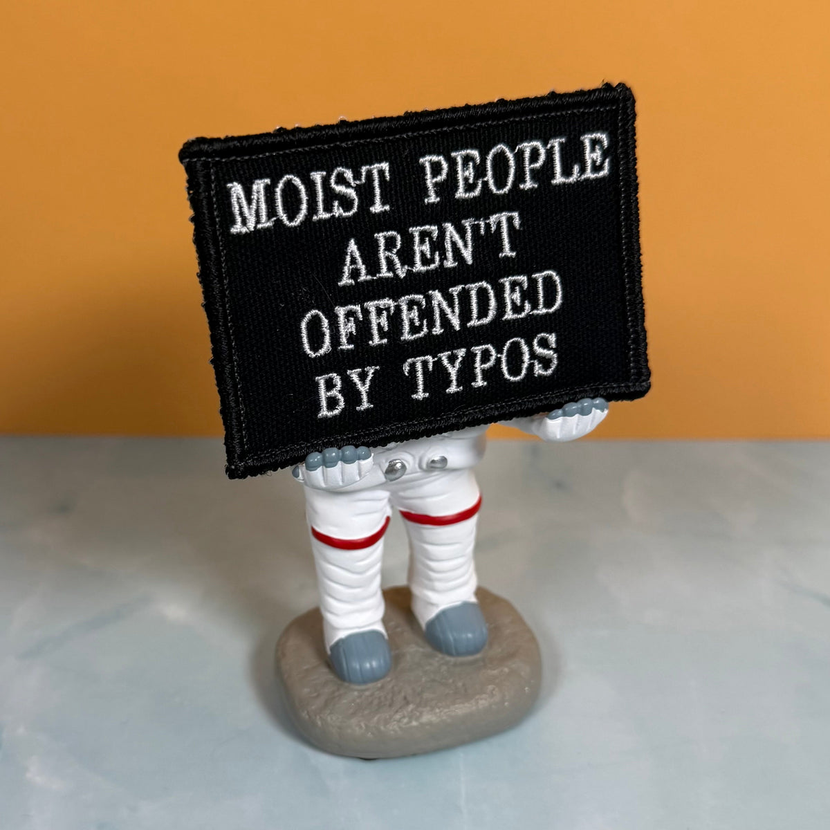 Moist People Aren’t Offended by Typos Funny Morale Patch, 2x3" | Made in USA | VELCRO® Brand Hook Backing