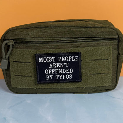 Moist People Aren’t Offended by Typos Funny Morale Patch, 2x3" | Made in USA | VELCRO® Brand Hook Backing