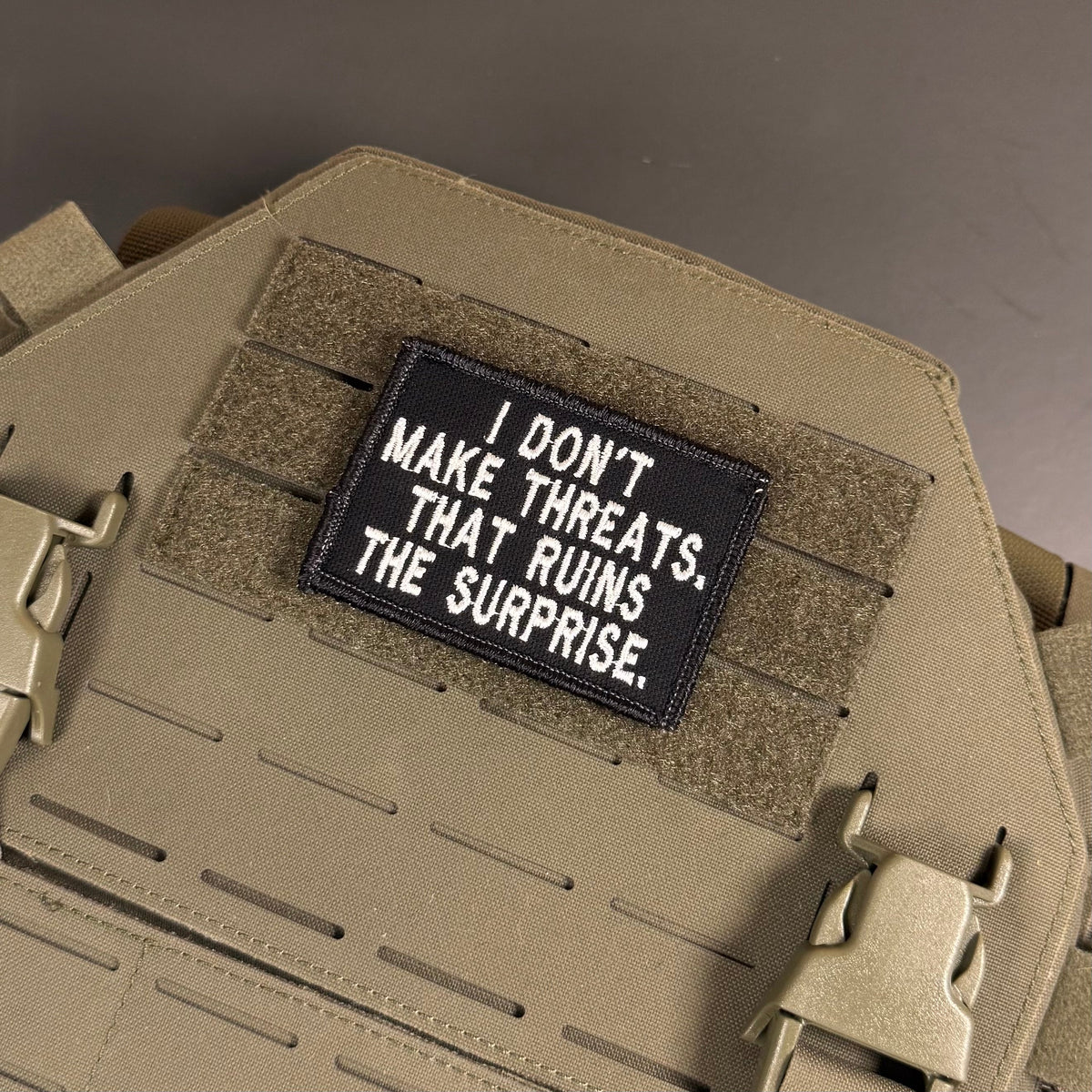 I Don't Make Threats, That Ruins The Surprise Funny Morale Patch, 2x3" | Made in USA | VELCRO® Brand Hook Backing