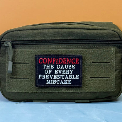 Confidence Causes Mistakes Funny Embroidered Morale Patch, 2x3" | VELCRO® Brand Hook Backing