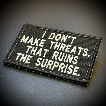 I Don't Make Threats, That Ruins The Surprise Funny Embroidered Morale Patch, 2x3" | VELCRO® Brand Hook Backing